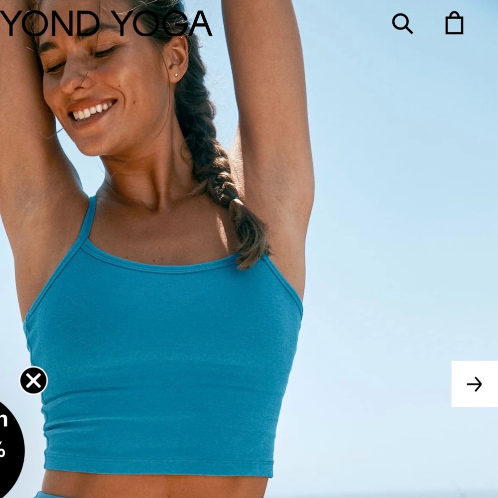 Beyond Yoga turquoise yoga top with criss cross back straps